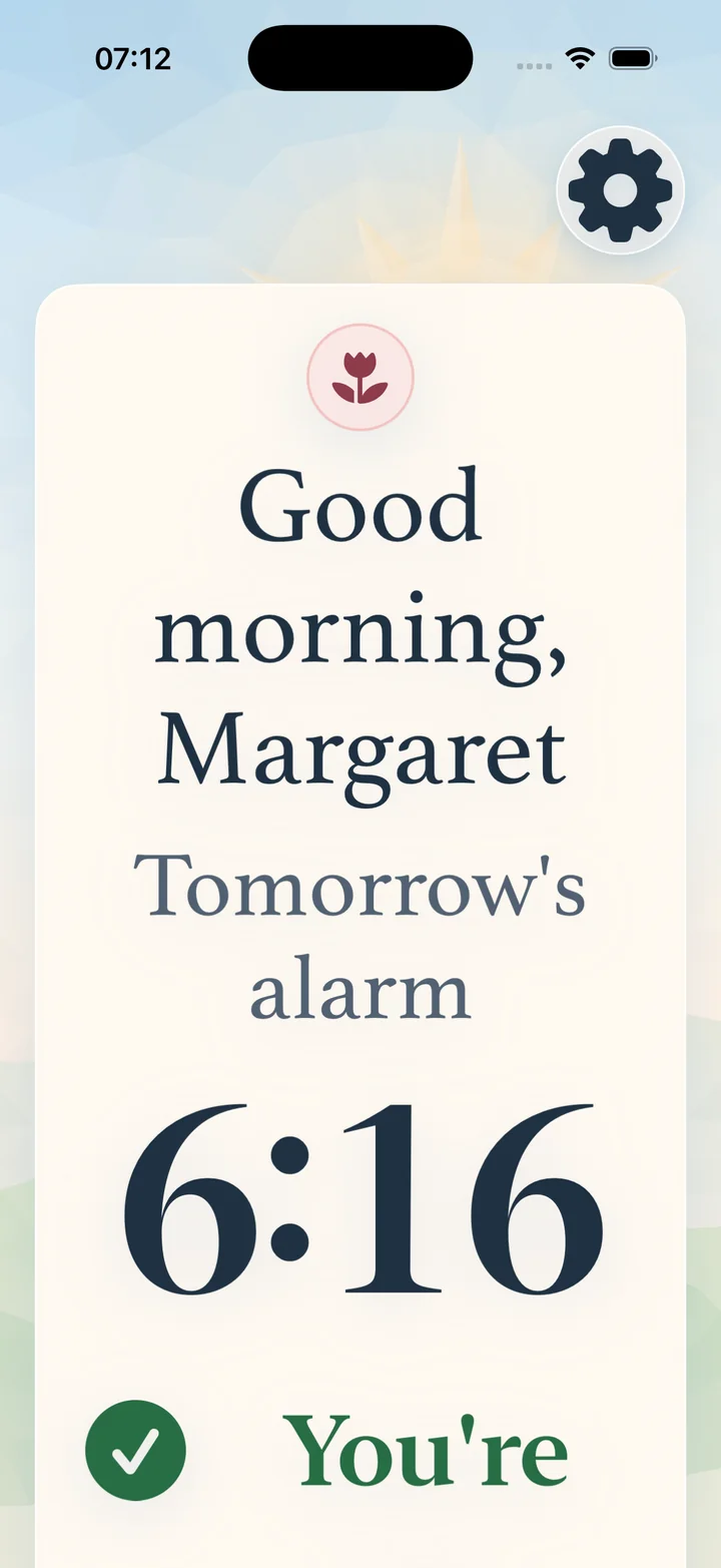 Athena med største tekststørrelse: «God morgen, Margaret» og morgendagens alarm kl. 6:16 i svært store, tydelige bokstaver.
